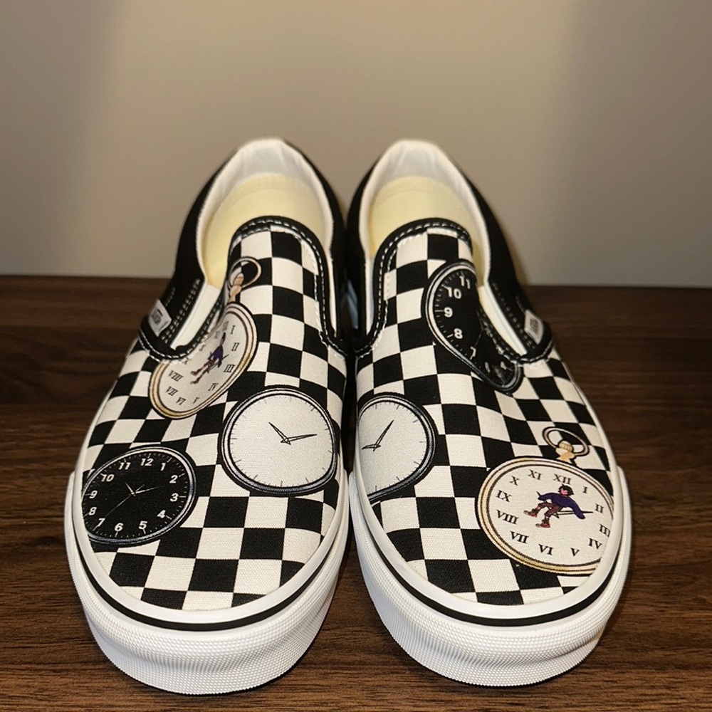 Vans Black and White Checkerboard Slip-On Sneakers